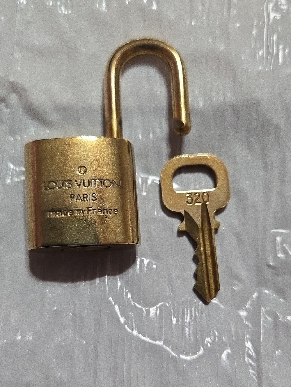 Louis Vuitton Gold Padlock Set of Four with LV Monogram - Picture 4 of 6